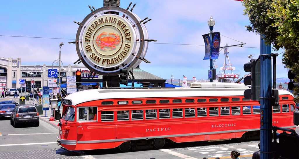 fishermans Wharf Crab Wheel sign with F line Trolley